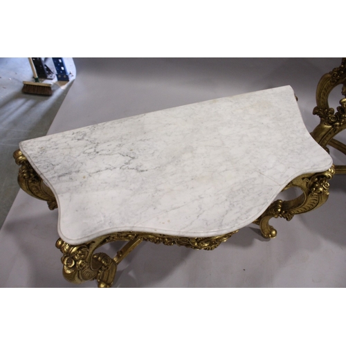 85 - A PAIR OF GILDED AND MARBLE TOP CONSOLE TABLES with white speckled marble tops, gilt bases with curv... 