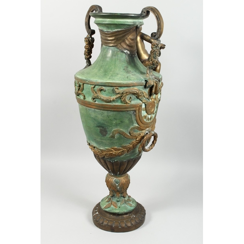 88 - A BRONZE TWO HANDLED URN with cupid, acanthus scroll and laurel leaf handles, 2 ft. 8 in high.