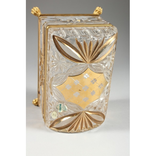 9 - A CUT GLASS AND GILDED CASKET with domed top on clawed feet, 7 in. wide.