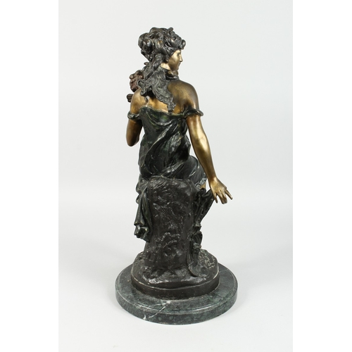 90 - AFTER MOREAU, A TWO COLOURED BRONZE OF A CLASSICAL GIRL with winged cherub on a circular marble base... 