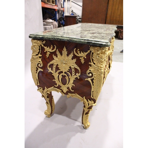 91 - AN ENORMOUS LOUIS XVITH STYLE MARBLE TOPPED COMMODE with shaped grey marble top.  The front smothere... 