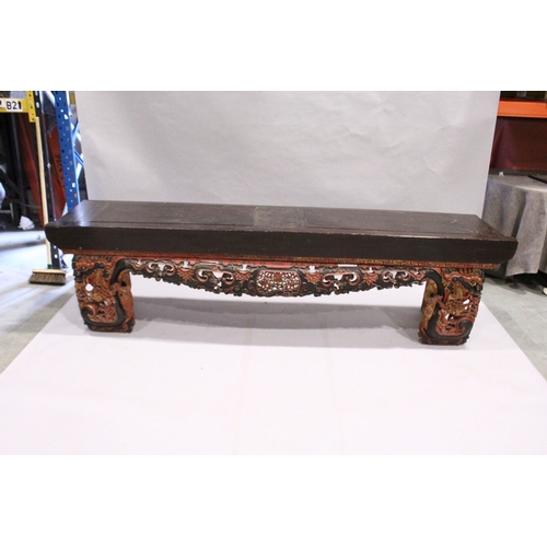 92 - A LONG 17TH / 18TH CENTURY CHINESE ALTAR TABLE, the base carved and pierced with flowers and dragons... 