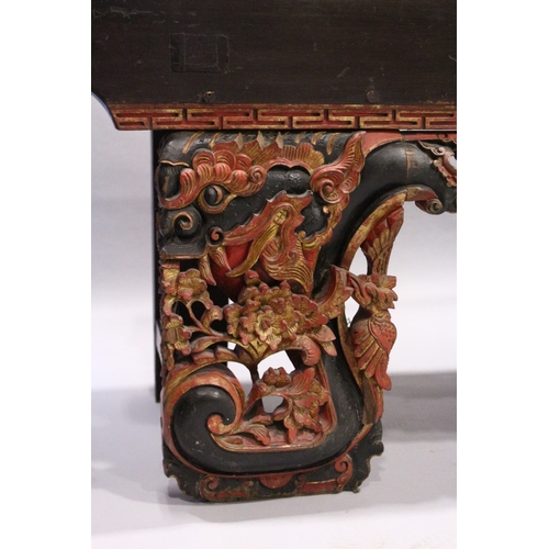 92 - A LONG 17TH / 18TH CENTURY CHINESE ALTAR TABLE, the base carved and pierced with flowers and dragons... 