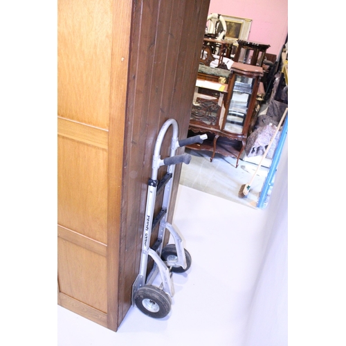 93 - A GOOD HABERDASHERY CABINET  with eight pairs of sliding glass drawers with brass handles.  The base... 