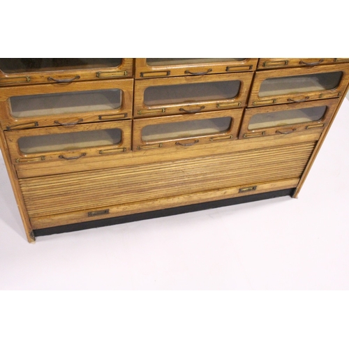 94 - A GOOD HABERDASHERY CABINET with ten rows of three drawers with metal handles, tambour to the base, ... 