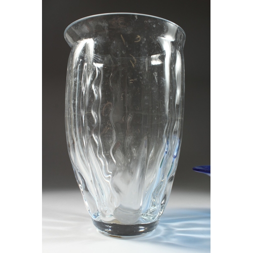 100 - A PLAIN GLASS VASE  13 ins. high and A BLUE GLASS DISH 11 ins. diameter.