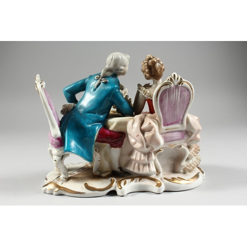 102 - A CONTINENTAL PORCELAIN GROUP GALLANT AND LADY, 8 ins. high.