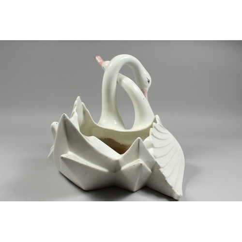 104 - A CONTINENTAL POTTERY ENTWINED SWAN BOWL, 11ins high.