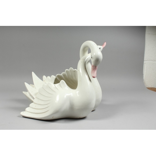 104 - A CONTINENTAL POTTERY ENTWINED SWAN BOWL, 11ins high.