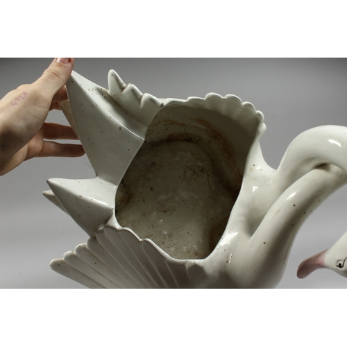 104 - A CONTINENTAL POTTERY ENTWINED SWAN BOWL, 11ins high.