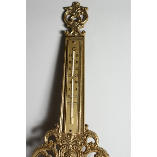 117 - A FOUR DIAL CLOCK BAROMETER in a gilded  frame, 31.5 ins long