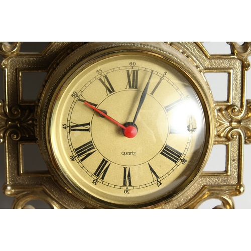 117 - A FOUR DIAL CLOCK BAROMETER in a gilded  frame, 31.5 ins long