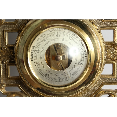 117 - A FOUR DIAL CLOCK BAROMETER in a gilded  frame, 31.5 ins long