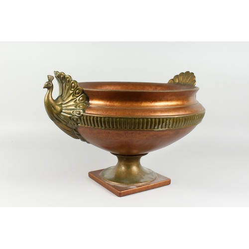 123 - A COMPOSITION GILT CIRCULAR JARDINIERE with swan handles, 16 ins diameter