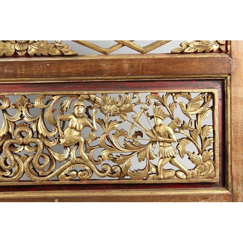 125 - A CHINESE PIERCED AND GILDED PANEL 37 ins x 23 ins.