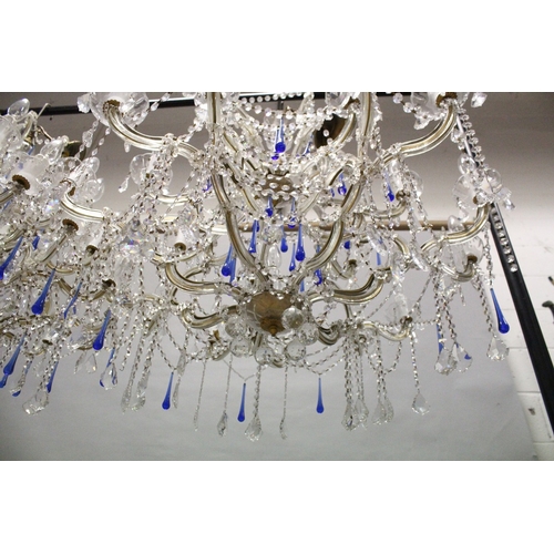 127 - A GOOD LARGE PAIR OF TWO TIER ITALIAN CHANDELIERS with twenty one scrolling branches with prism drop... 