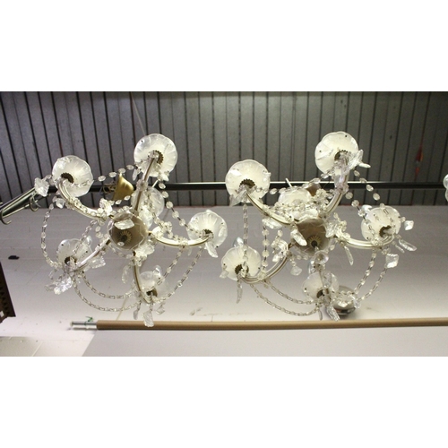 131 - A SMALL PAIR OF ITALIAN GLASS FIVE LIGHT CHANDELIERS with prism drops. 1 ft. 6 ins wide, 1 ft. high.... 