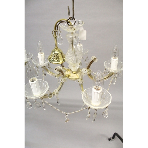 132 - A SMALL PAIR OF ITALIAN GLASS FIVE LIGHT CHANDELIERS with prism drops. 1 ft. 6 ins. wide, 1ft high.... 