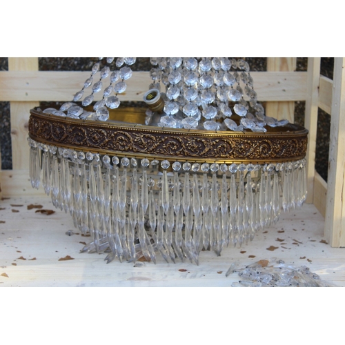 134 - A LARGE ORMULU AND CUT GLASS BAG STYLE CHANDELIER 3 ft 6 ins high x 2 ft wide