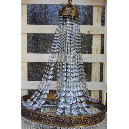 134 - A LARGE ORMULU AND CUT GLASS BAG STYLE CHANDELIER 3 ft 6 ins high x 2 ft wide