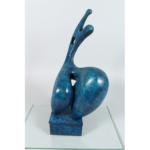 136 - A BRONZE BLUE ABSTRACT MODEL on a rectangular base. 19 ins high.