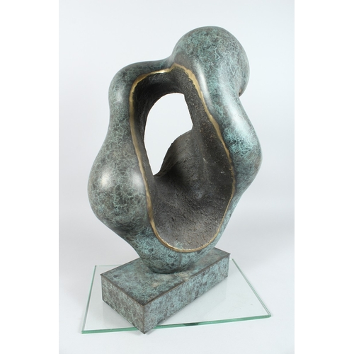 140 - A LARGE ABSTRACT SPECKLED BRONZE ENTWINED FIGURE on a rectangular  base, 20ins. high.