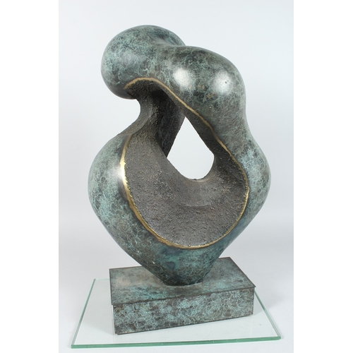 140 - A LARGE ABSTRACT SPECKLED BRONZE ENTWINED FIGURE on a rectangular  base, 20ins. high.