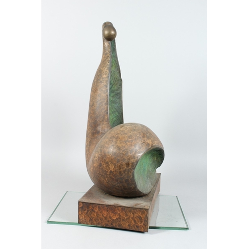 141 - A LARGE ABSTRACT SPECKLED BRONZE FIGURE on a rectangular shell. 20 ins high.