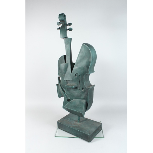 143 - AN ABSTRACT BRONZE CELLO on an rectangular base 34 ins high.