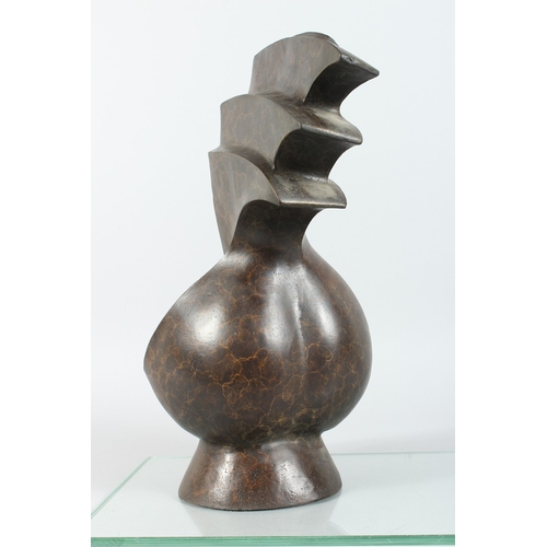 145 - A BRONZE ABSTRACT SCULPTURE 17 ins high.