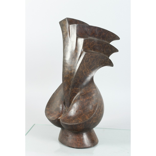 145 - A BRONZE ABSTRACT SCULPTURE 17 ins high.