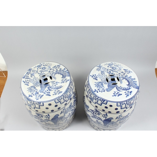 151 - A PAIR OF CHINESE BLUE AND WHITE BARREL SEATS with birch and flowers 17 ins high