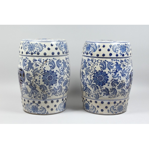 152 - A PAIR OF CHINESE BLUE AND WHITE BARREL SEATS with scrolls, 17 ins high