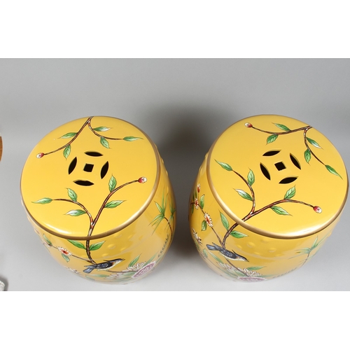 153 - A PAIR OF CHINESE YELLOW BARREL SEATS with birch and flowers 17 ins high