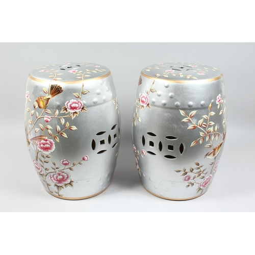 154 - A PAIR OF CHINESE SILVER BARREL SEATS with peonies 17 ins high