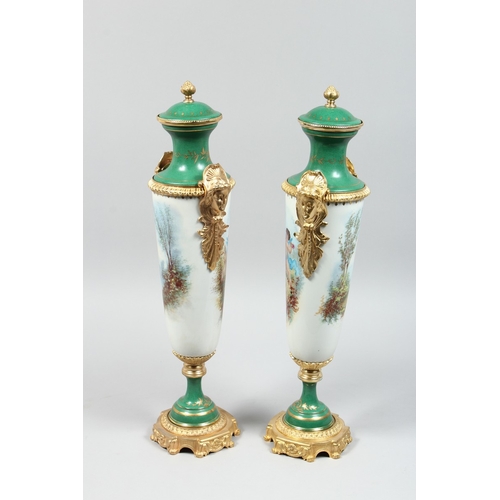 155 - A GOOD PAIR OF SEVRES DESIGN TWO HANDLED VASE AND COVER painted with cupids, 27 ins high.