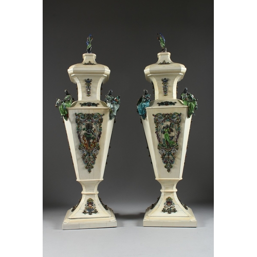 157 - A SUPERB PAIR OF VIENNA IVORY TAPERING VASES AND COVERS, mounted silver and enamel plaques set with ... 