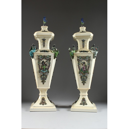 157 - A SUPERB PAIR OF VIENNA IVORY TAPERING VASES AND COVERS, mounted silver and enamel plaques set with ... 