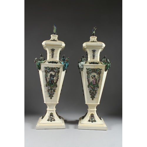 157 - A SUPERB PAIR OF VIENNA IVORY TAPERING VASES AND COVERS, mounted silver and enamel plaques set with ... 