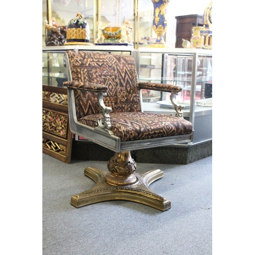 160 - A HIGHLY ORNATE CAST AND POLISHED STEEL AND BRASS REVOLVING ARMCHAIR, possible originally a barber's... 