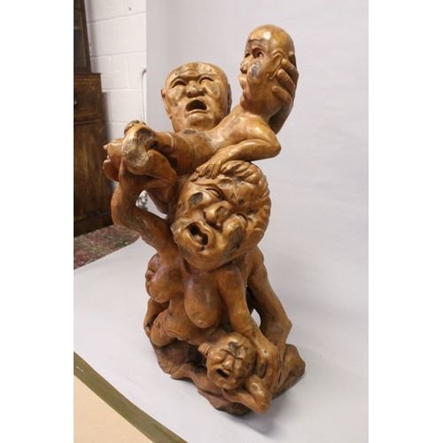 161 - A LARGE UNUSUAL CHINESE ROOTWOOD SCULPTURE OF A MOTHER, FATHER AND THREE CHILDREN, all with anxious ... 