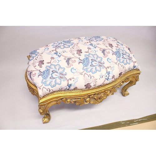 164 - A GILT WOOD LARGE STOOL, upholstered with a floral print fabric on cabriole legs 3 ft 10 ins long x ... 