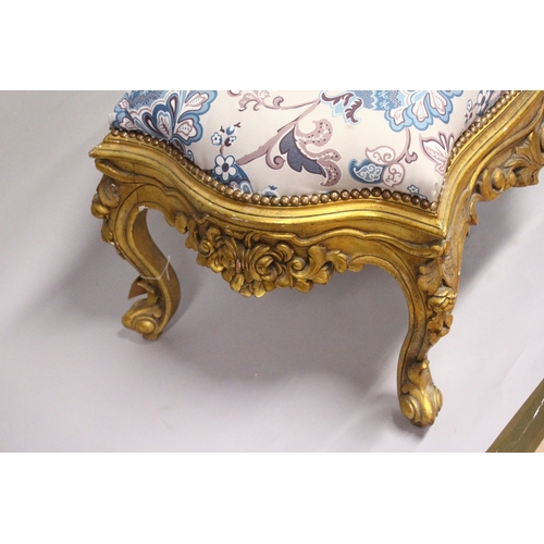 164 - A GILT WOOD LARGE STOOL, upholstered with a floral print fabric on cabriole legs 3 ft 10 ins long x ... 