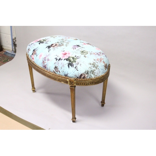 165 - A GILT WOOD LARGE STOOL, upholstered with a  floral print, on square legs. 3 ft 3 ins long x 2 ft  w... 