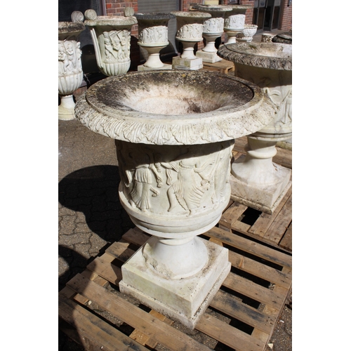 181 - A SUPERB NEAR PAIR OF ITALIAN CARVED WHITE MARBLE URNS ON STANDS, the sides covered with dancing lad... 