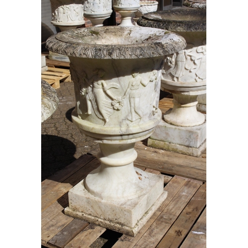 181 - A SUPERB NEAR PAIR OF ITALIAN CARVED WHITE MARBLE URNS ON STANDS, the sides covered with dancing lad... 