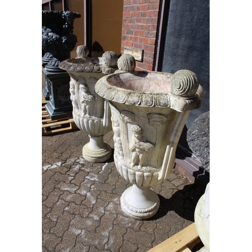 183 - A SUPERB NEAR PAIR OF ITALIAN CARVED WHITE MARBLE TWO HANDLED URNS. the sides carved with cupids wit... 