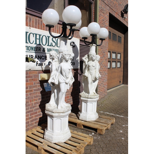 184 - AN EXTREMELY LARGE PAIR OF WHITE COMPOSITION LAMPS, each formed as three classical figures holding a... 