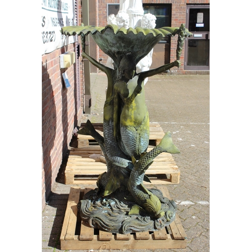 185 - A LARGE CAST IRON WATER FEATURE as two mermaids and a dolphin on a scroll base. 5 ft high.