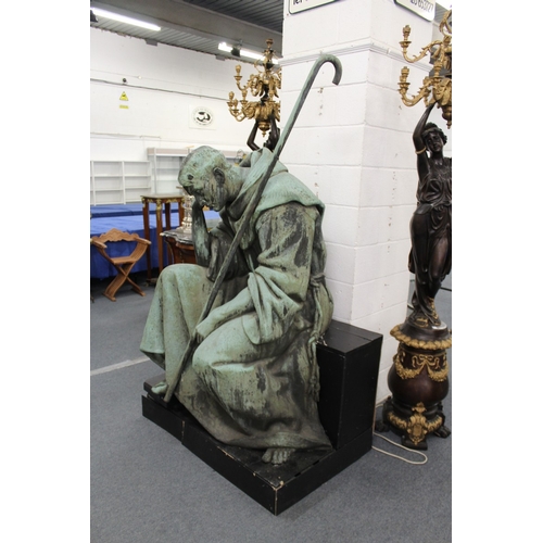 187 - ITALIAN CIRCA. 1875 A MASSIVE COPPER SCULPTURE OF SAINT FRANCIS OF ASSISI seated resting his head on... 